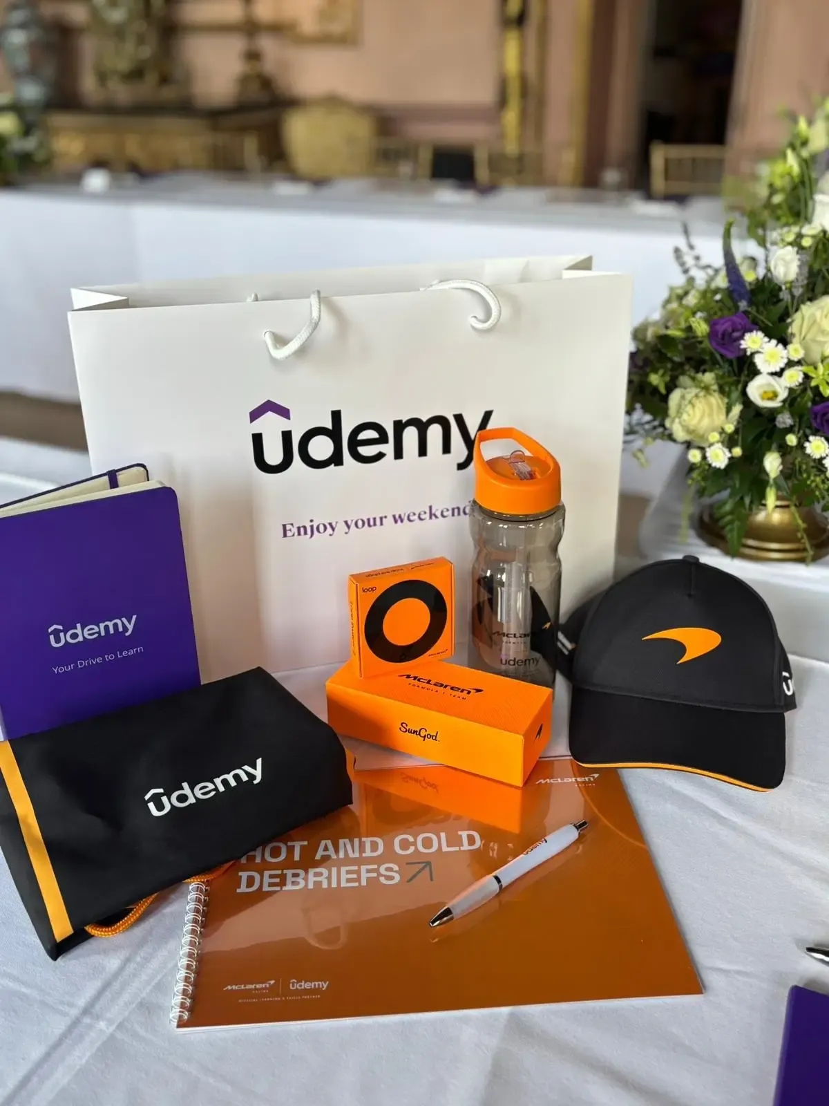 A collection of Udemy merchandise is displayed on a table. (Image: Udemy)