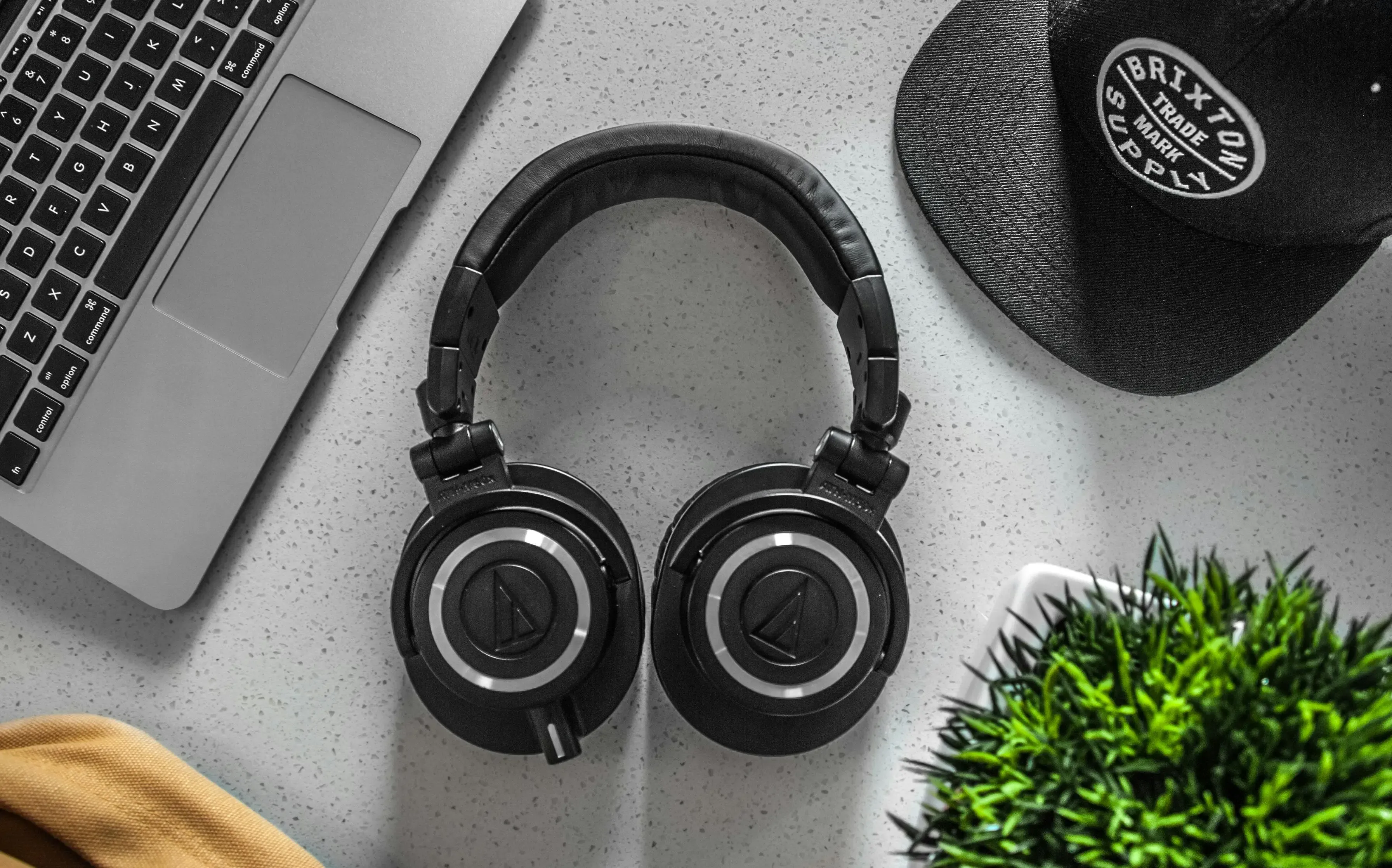 A black headphones lying on a table.