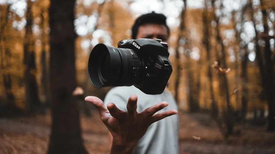 A young photographer outdoors holding a camera, focusing on composition and learning photography fundamentals