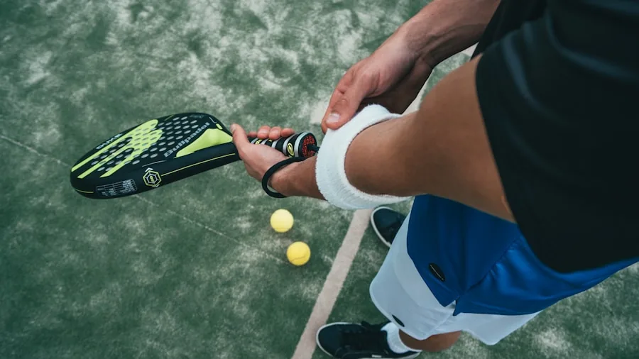 Close-up of hands inspecting pickleball paddle surface material and texture during gameplay