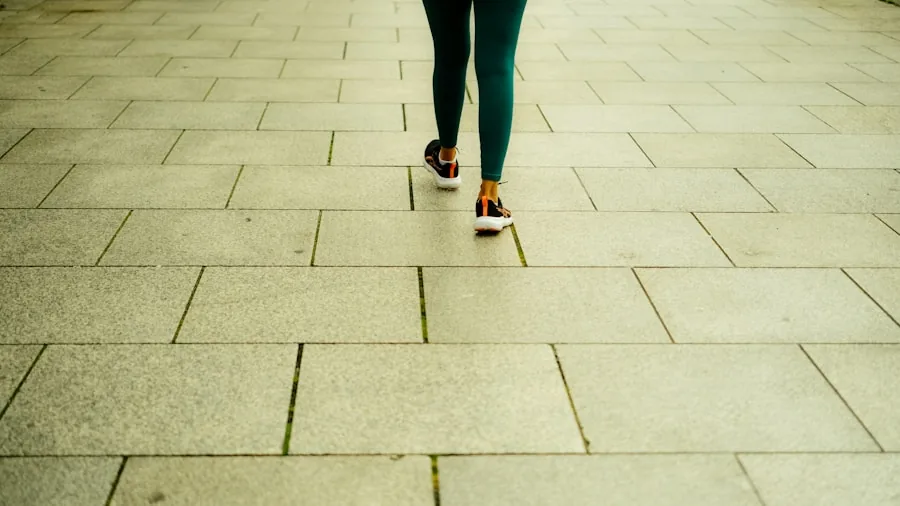 Close-up of runner's feet and shoes making contact with pavement during outdoor run