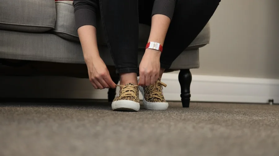 Close-up of someone checking the fit of a walking shoe by measuring thumb space near toes