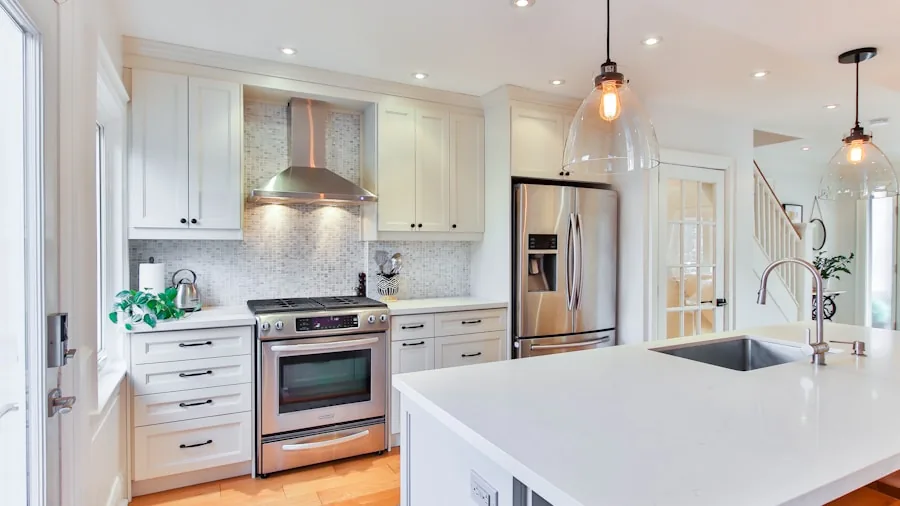 Contemporary kitchen with stainless steel appliances and open shelving in a bright, modern home
