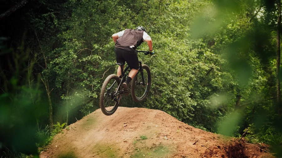Cyclist riding electric bike on outdoor trail with natural scenery