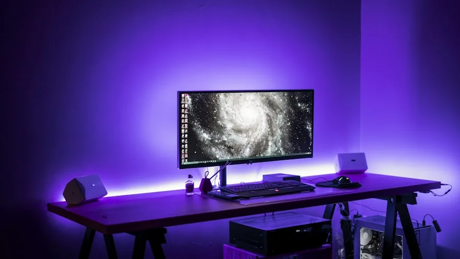 Dark gaming desk with vibrant RGB lighting creating atmospheric glow in a modern room