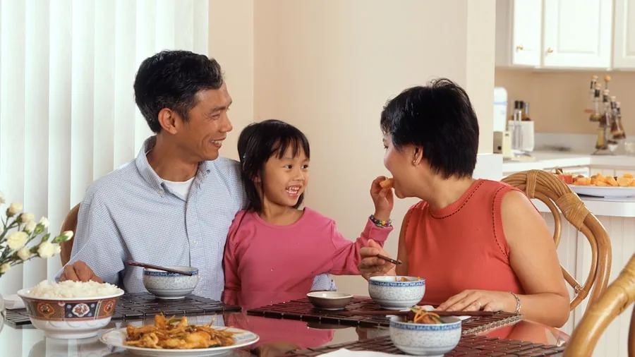 Family enjoying a quiet conversation in a modern open-plan kitchen with natural light