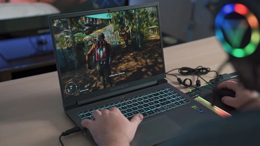 Gamer working on laptop with low battery indicator visible on screen during intense gaming session