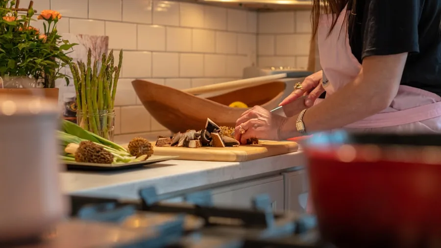 Home cook preparing meal at stovetop in modern kitchen with various cookware