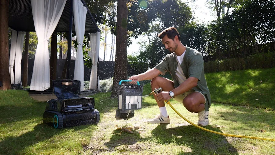 Homeowner using cordless lawn mower on suburban yard during spring maintenance