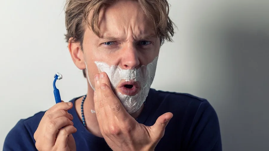 Man shaving in bathroom mirror during morning grooming routine