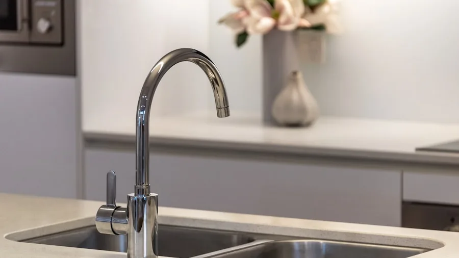 Modern kitchen with gleaming stainless steel sink and countertop during natural daylight
