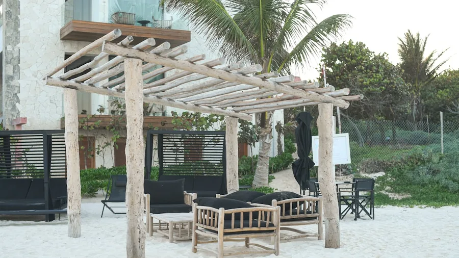 Modern outdoor seating area with aluminum frame furniture overlooking a coastal landscape