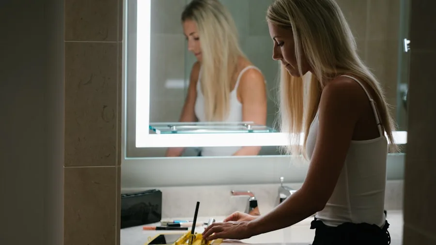 Person brushing teeth at bathroom sink mirror during morning routine