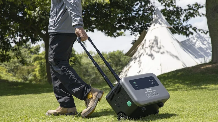 Person carrying a portable generator while hiking through a forest trail