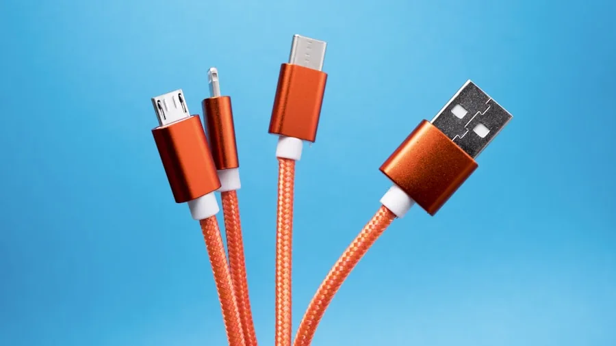 Person charging multiple smartphones and devices with various USB cables on a desk
