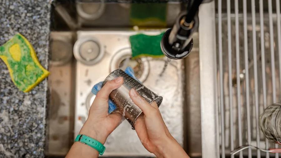 Person cleaning dishes in kitchen sink with soapy water, representing easy cleanup and kitchen maintenance