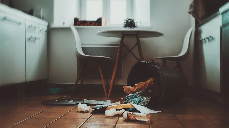 Person cleaning kitchen counter with crumbs, maintaining hygiene and tidiness in modern home kitchen