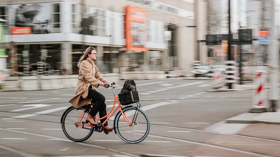 Person commuting on electric bike through urban neighborhood street on a sunny day