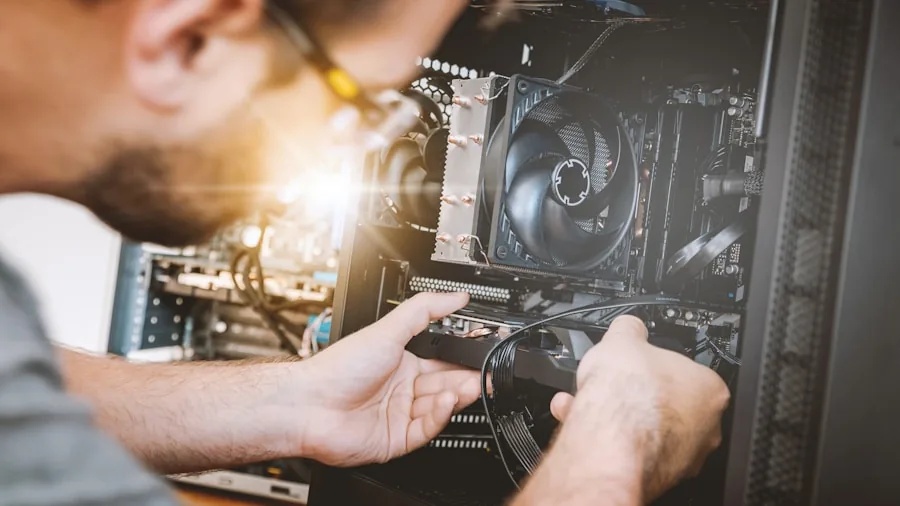 Person connecting cables to gaming PC tower during system upgrade and setup