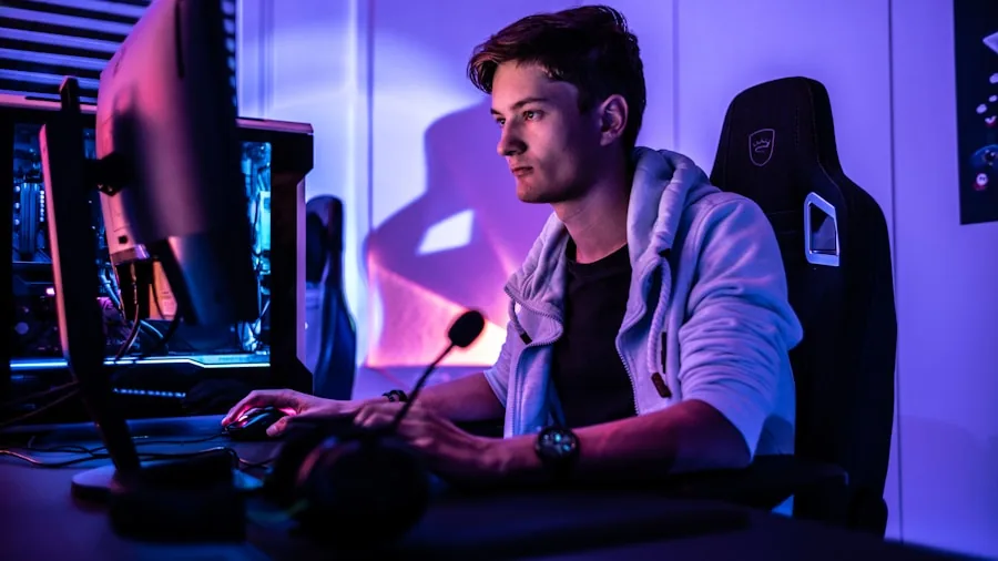 Person deeply focused while gaming on laptop with dramatic lighting