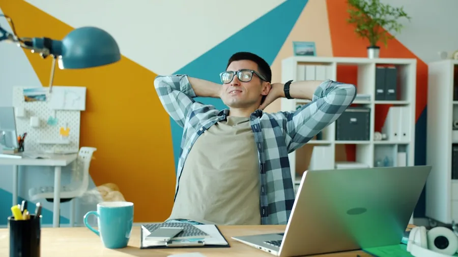 Person demonstrating correct sitting posture at desk with proper back support and ergonomic alignment
