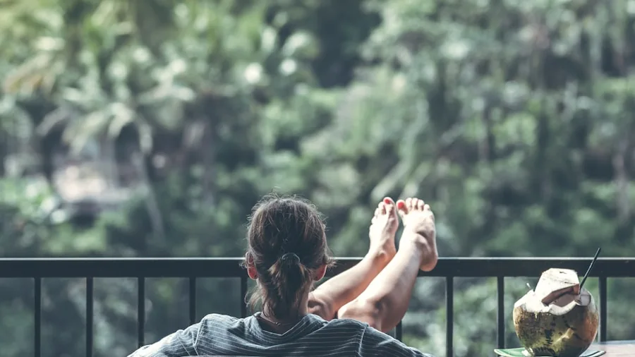 Person enjoying a relaxing moment at home in a comfortable chair, representing accessible wellness and self-care