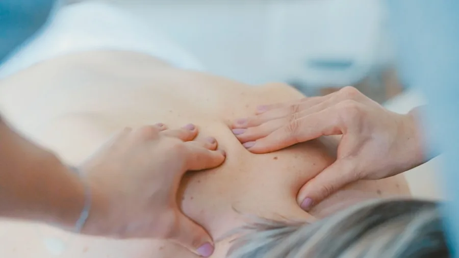 Person enjoying a soothing shoulder and neck massage to relieve tension and stress