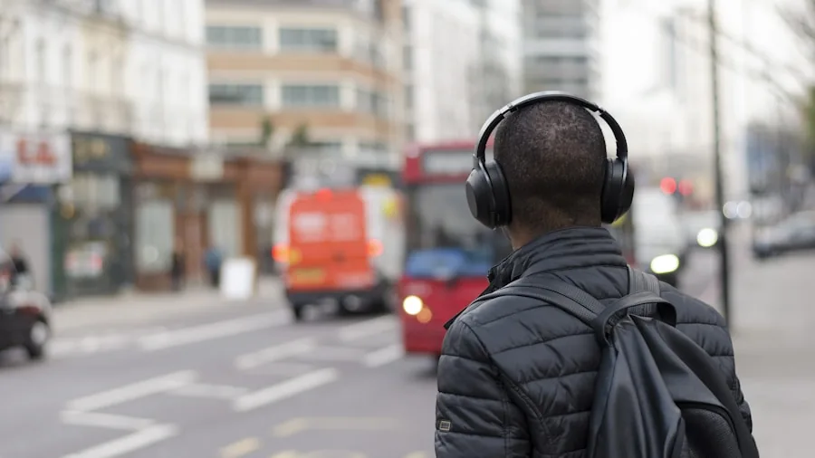 Person enjoying peaceful moment with headphones during daily commute in urban environment