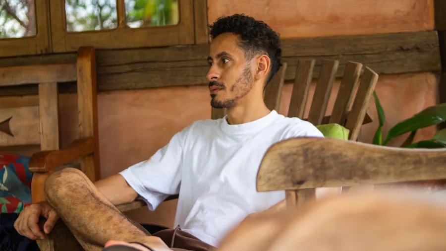 Person enjoying peaceful moment with wireless earbuds in a quiet, serene environment