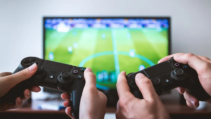 Person gaming across multiple platforms and devices in comfortable home setup