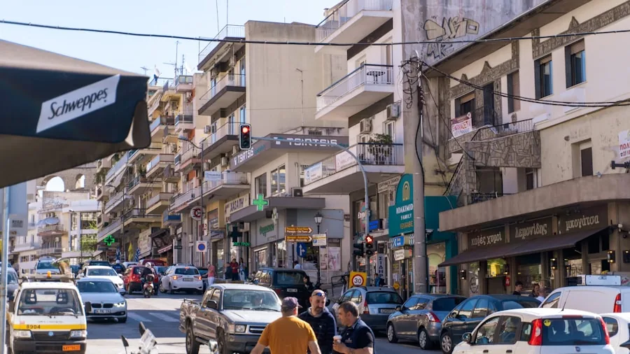 Person having a phone call on a busy urban street with background noise and traffic
