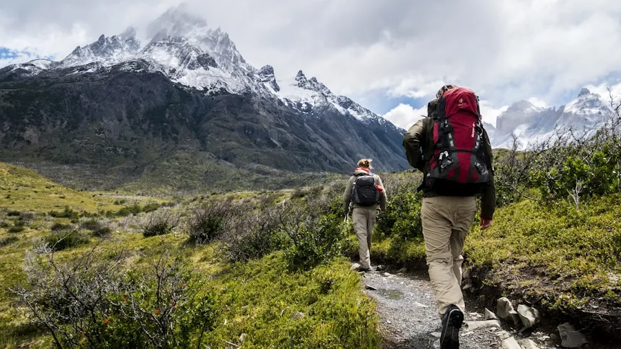 Person hiking on mountain trail wearing versatile boots suitable for casual everyday wear