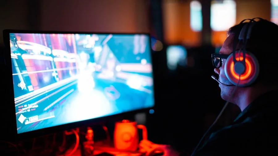 Person intensely focused while gaming on laptop, demonstrating competitive gaming experience and display performance