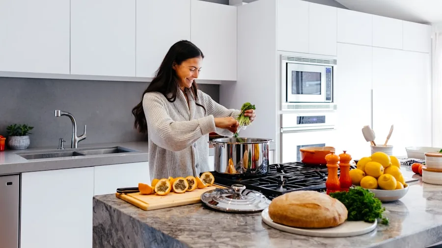 Person preparing fresh food in a modern, minimalist kitchen with simple cooking setup
