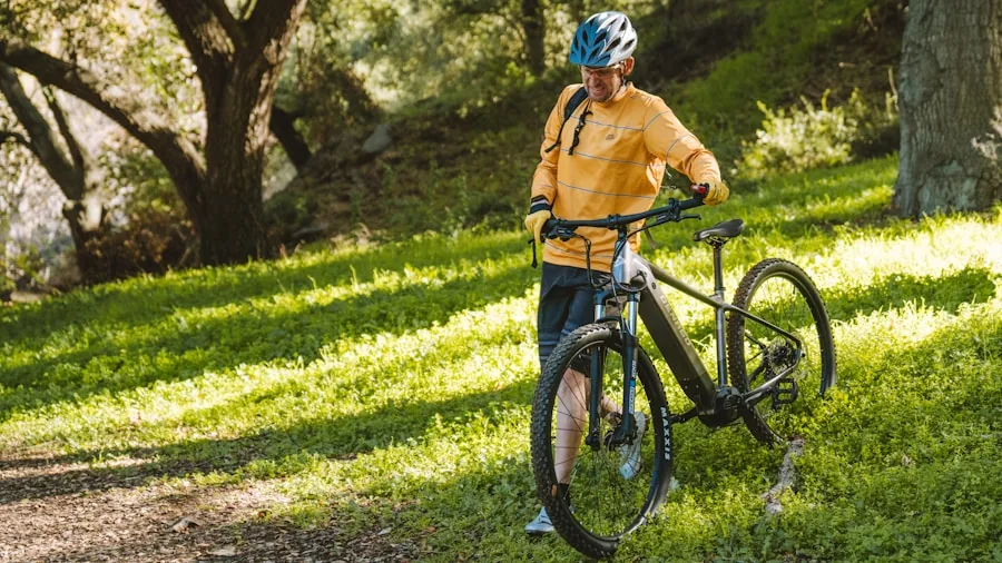 Person riding electric bike on outdoor trail with natural scenery