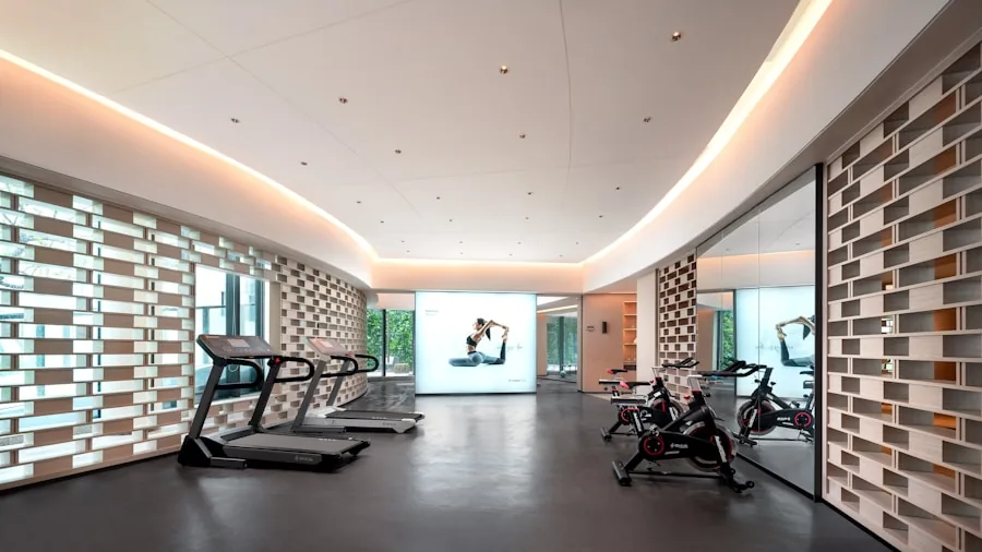 Person running on treadmill in home gym with focus on proper form and cushioned impact