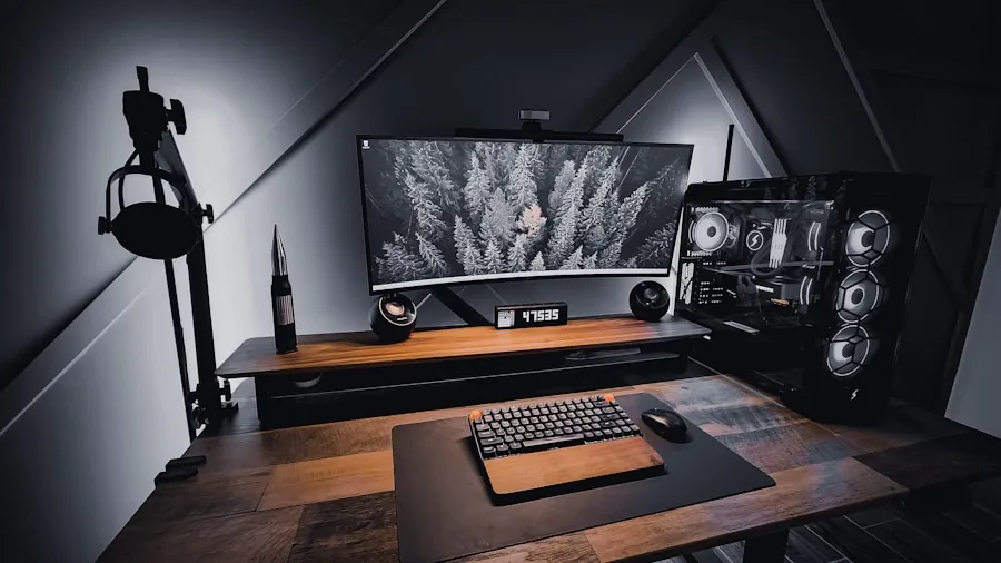 Person sitting at gaming desk with multiple monitors and computer setup in home environment