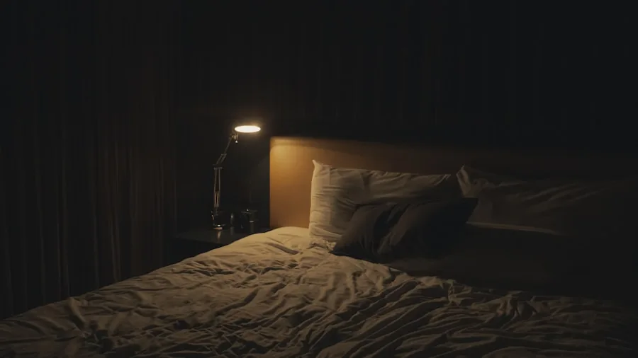 Person sleeping peacefully in a dark, quiet bedroom at night
