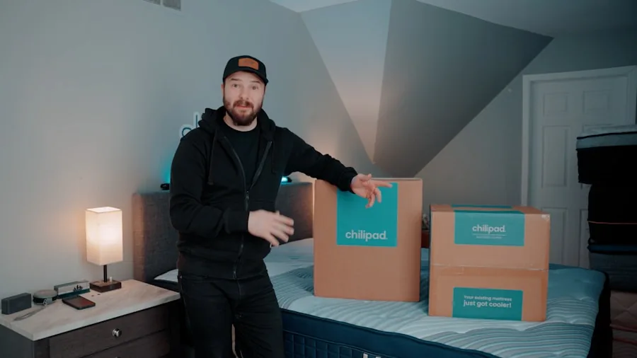 Person unboxing a compressed mattress in a bedroom, preparing to set it up on a bed frame
