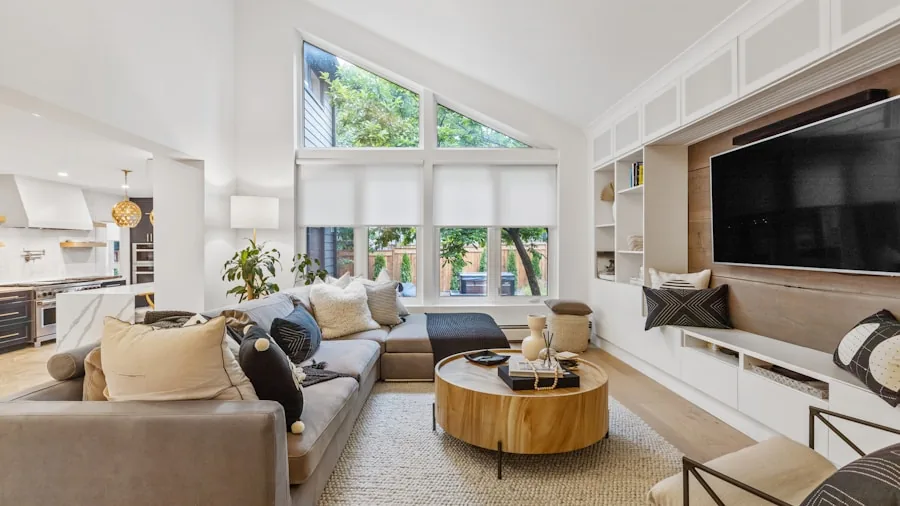 Person using smart display device in modern home to view security camera feed