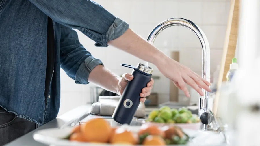 Person washing dishes and cleaning in a bright kitchen sink, representing easy cleanup routines