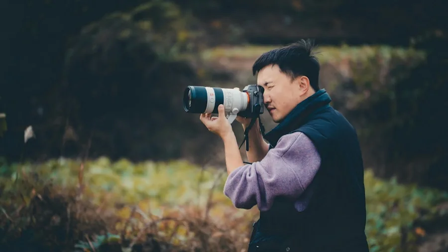 Photographer selecting camera lenses while planning outdoor shoot in natural daylight