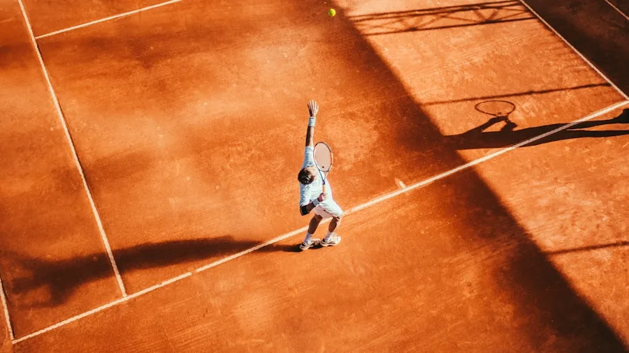 Player demonstrating proper two-handed backhand grip technique on outdoor court