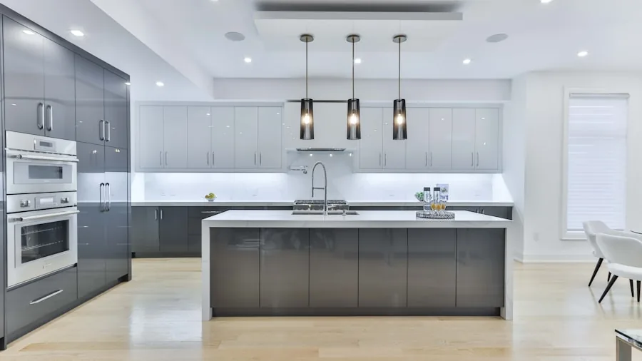 Professional installing built-in dishwasher under kitchen counter in modern home