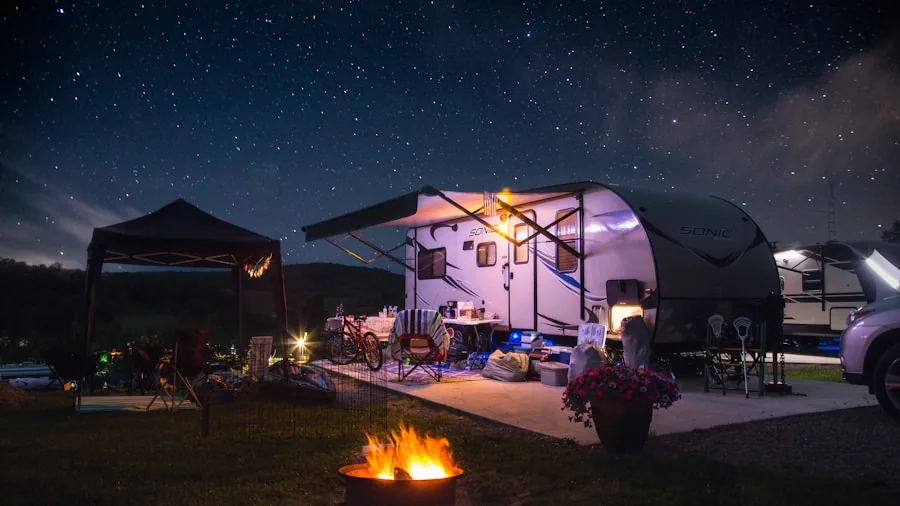 Two portable generators connected together during outdoor camping trip in natural setting