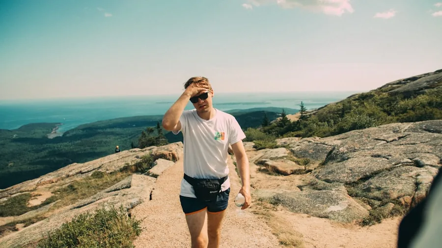 Woman jogging uphill on a natural outdoor trail, demonstrating incline training for fitness